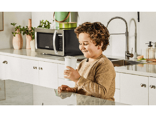 Child enjoying a cold beverage